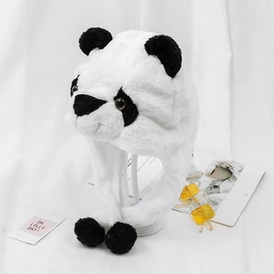 Winter plush panda hat with warm ear flaps and black fluffy pom-poms on white background