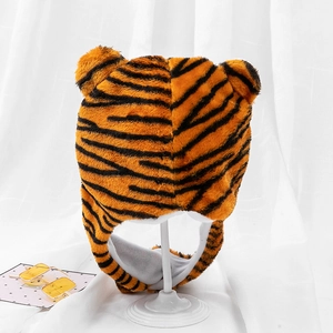 Detailed view of plush tiger hat with orange black stripes and soft velvet lining