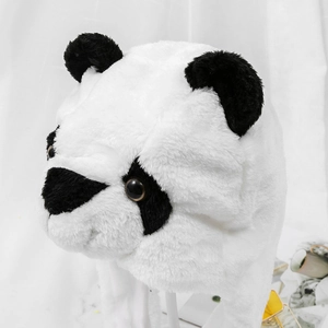 Close-up of soft plush panda hat featuring fluffy black ears and detailed faux fur texture