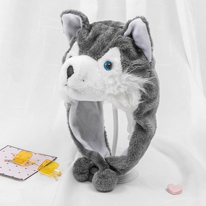 Detail of plush husky hat showing gray faux fur texture and cute blue eyes embroidery