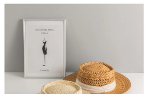 Close-up detail of high-quality woven straw texture on classic Panama sun hats