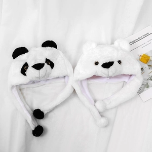 Close-up of soft plush panda and polar bear earflap hats with cute 3D ears and embroidery