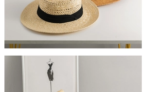 Close-up of hand-woven straw hat texture with black ribbon and intricate hollow patterns