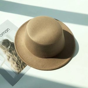 Classic khaki felt boater hat with wide brim and detailed stitching for autumn winter