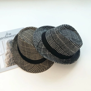 Classic houndstooth wool fedora hat with black ribbon band in vintage British style
