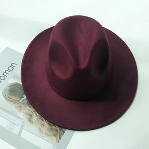 Top view of a burgundy wool felt fedora hat for children on a clean white background