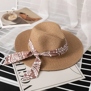 Vintage woven straw panama hat with brown paisley ribbon and wide sun protection brim