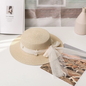 Elegant flat top boater straw hat featuring white mesh ribbon and pearl decorations