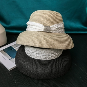 Hepburn style women's straw sun hat with elegant pleated fabric band and rhinestone buckle
