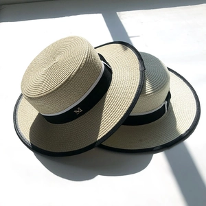 British style beige flat top boater hat with black ribbon and gold M metal letter