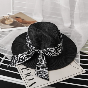 Women's black straw panama hat with paisley ribbon bow for summer beach sun protection