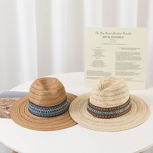 Bohemian straw fedoras with ethnic embroidered bands in dark brown and light beige colors