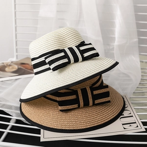 Striped ribbon straw hats in beige and brown with black piping for stylish sun protection