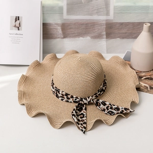 Straw sun hat with leopard ribbon and wavy brim for women beach vacation