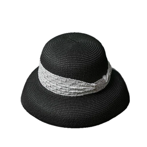 Elegant black straw sun hat with white pleated ribbon and sparkling rhinestone buckle