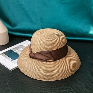 Summer khaki wide brim straw sun hat with a dark coffee satin ribbon bow for beach vacation