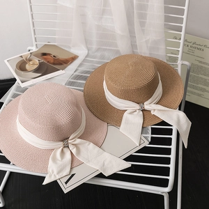 Elegant flat-top straw hat with silk ribbon and crystal buckle for summer beach trips