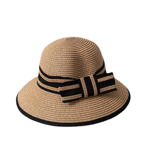 Straw cloche sun hat for women featuring a black ribbon band and striped bow decoration