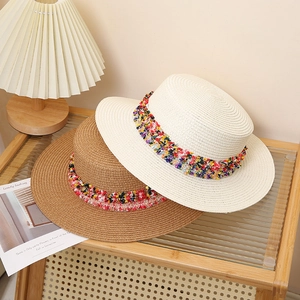 Bohemian women flat top straw hats with colorful tassel bands in beige and brown colors