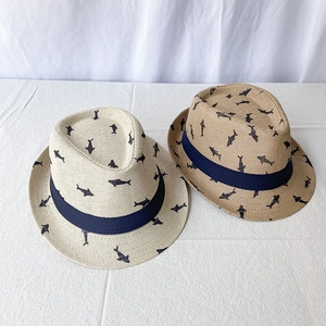 Detail of straw fedora hats with shark patterns and decorative grosgrain ribbon bands
