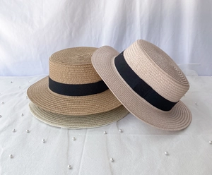 Three summer straw hats in beige and khaki with black grosgrain ribbons for sun protection