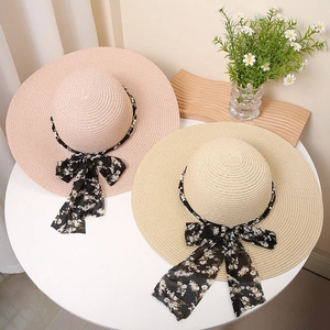 Women's wide brim straw sun hats with floral chiffon ribbons and elegant bows