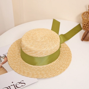Straw boater sun hat with olive green ribbon bow and long streamers for beach vacation