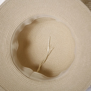 Detail showing inner sweatband and adjustable drawstring of the woven straw sun hat