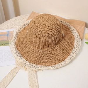 Summer hand-woven straw hat with white lace trim and adjustable drawstring for sun protection