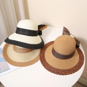 Women's summer straw beach sun hat with ribbon bow and contrast lace trim detail