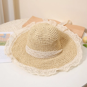 Straw sun hat with white lace trim and breathable hollow design for summer vacation