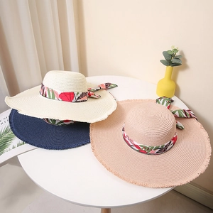 Women's wide brim straw sun hat with floral ribbon bow for summer beach vacation