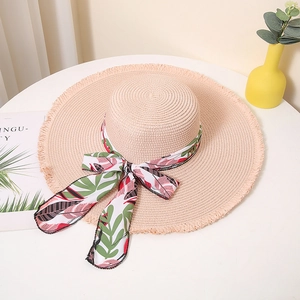 Summer wide brim straw sun hat with tropical floral ribbon and fringed edge for beach