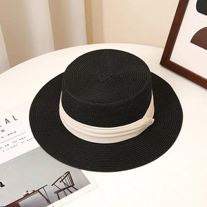 Classic black straw boater hat with a wide cream band for summer sun protection style