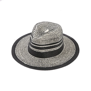 Men's wide-brim straw sun hat with black and white striped spiral weave pattern