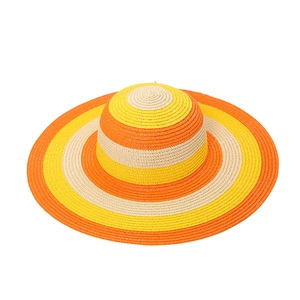 Women's summer straw beach hat with colorful orange and yellow concentric wide brim stripes