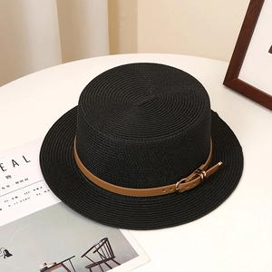 Detail of flat top straw boater hat with brown leather belt and metal buckle decor