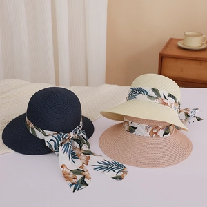 Summer wide brim sun hats with floral ribbons in navy, beige, and pink for beach vacations