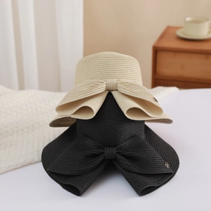 Summer woven sun hats with large bow detail and metal M logo in beige and black