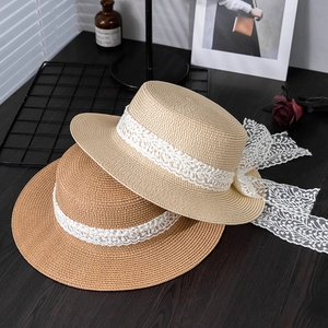 Summer wide-brim straw sun hats with white floral lace ribbons in beige and caramel
