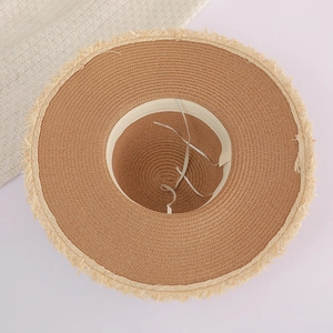 Detail view of the inner adjustable drawstring and soft sweatband on straw sun hat
