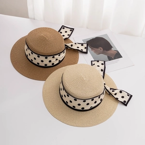 Elegant wide brim straw hats with polka dot ribbons and bow in beige and white