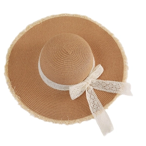 Women's summer straw hat with wide frayed brim and elegant white lace bow decoration