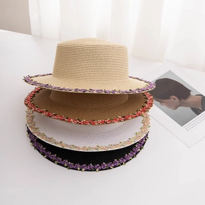Stacked women's straw sun hats with floral embroidery in beige, coffee, white and black