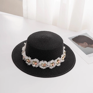 Summer black straw boater hat for women with sweet white and pink floral decorations