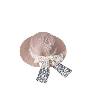 Summer wide brim pink straw hat with white lace ribbon and bow for outdoor sun protection