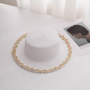 Summer flat top white straw sun hat with colorful floral embroidery for beach vacations