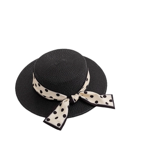 Elegant black straw boater hat for women with beige polka dot ribbon bow decoration