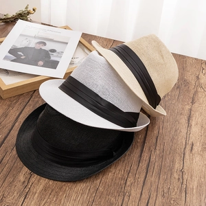 Three men's woven fedora hats in black, white and beige with stylish black satin ribbons
