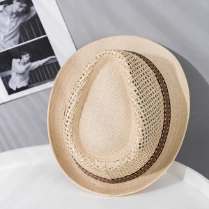 Close-up of breathable hollow-weave paper straw hat with stylish brown ribbon detail
